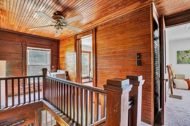 a view of a balcony with chairs