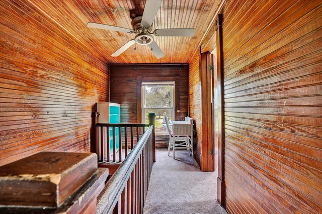 a view of a balcony with furniture