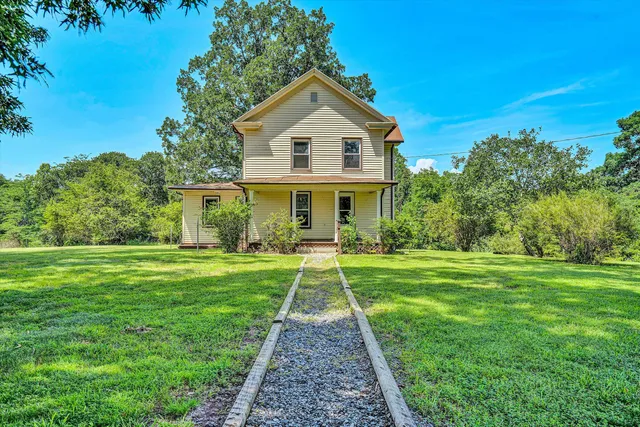 a front view of a house with a yard