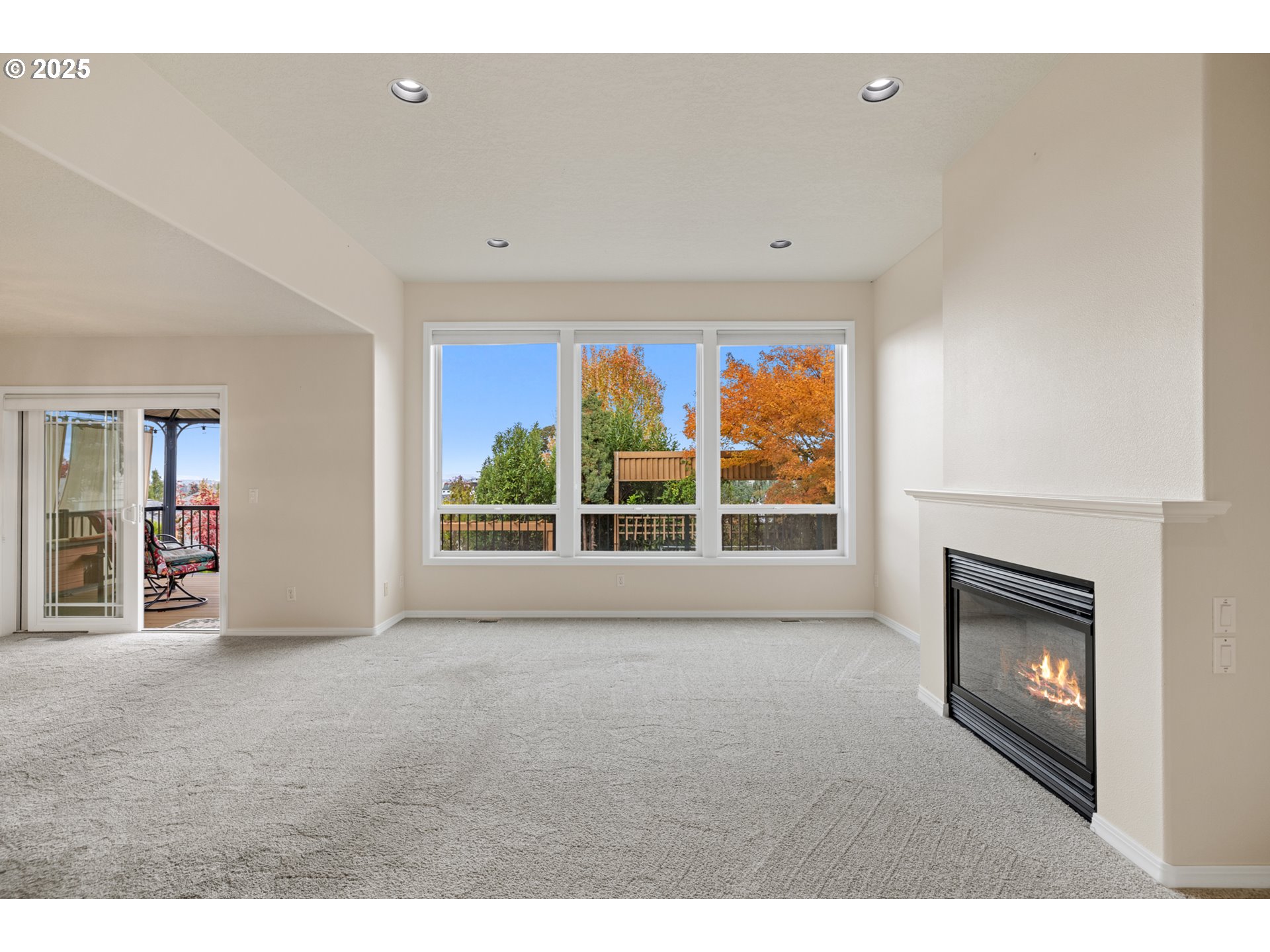 1409 Crestview Drive Silverton, OR 97381 - Photo 11 of 22 a view of an empty room with a fireplace and a window