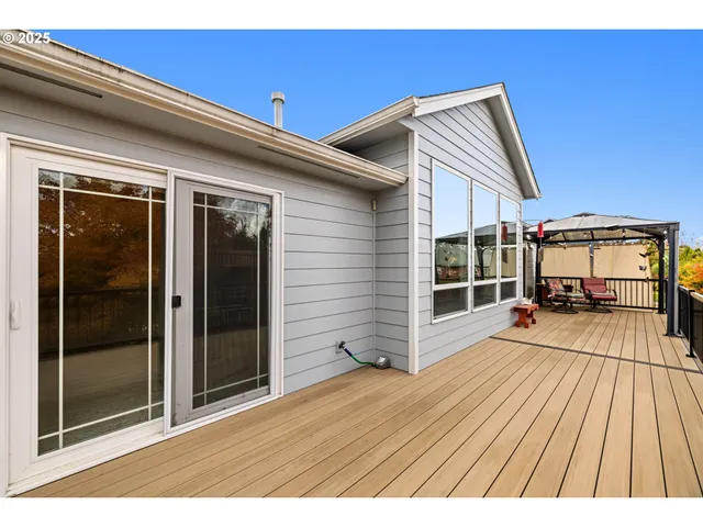 a view of a house with wooden fence