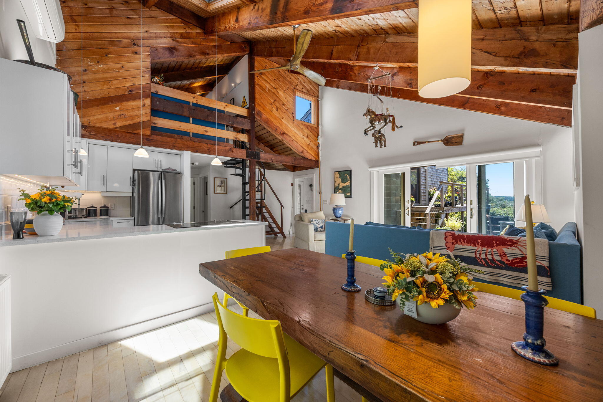 20 Lil's Way Wellfleet, MA 02631 - Photo 12 of 43 a view of a dining room with furniture and a potted plant