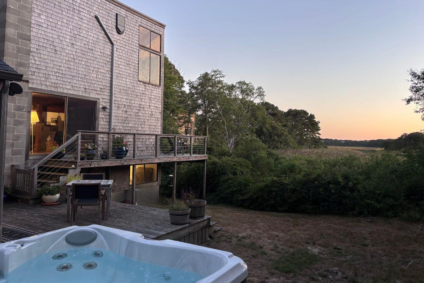 20 Lil's Way Wellfleet, MA 02631 - Photo 38 of 43 a backyard of a house with table and chairs