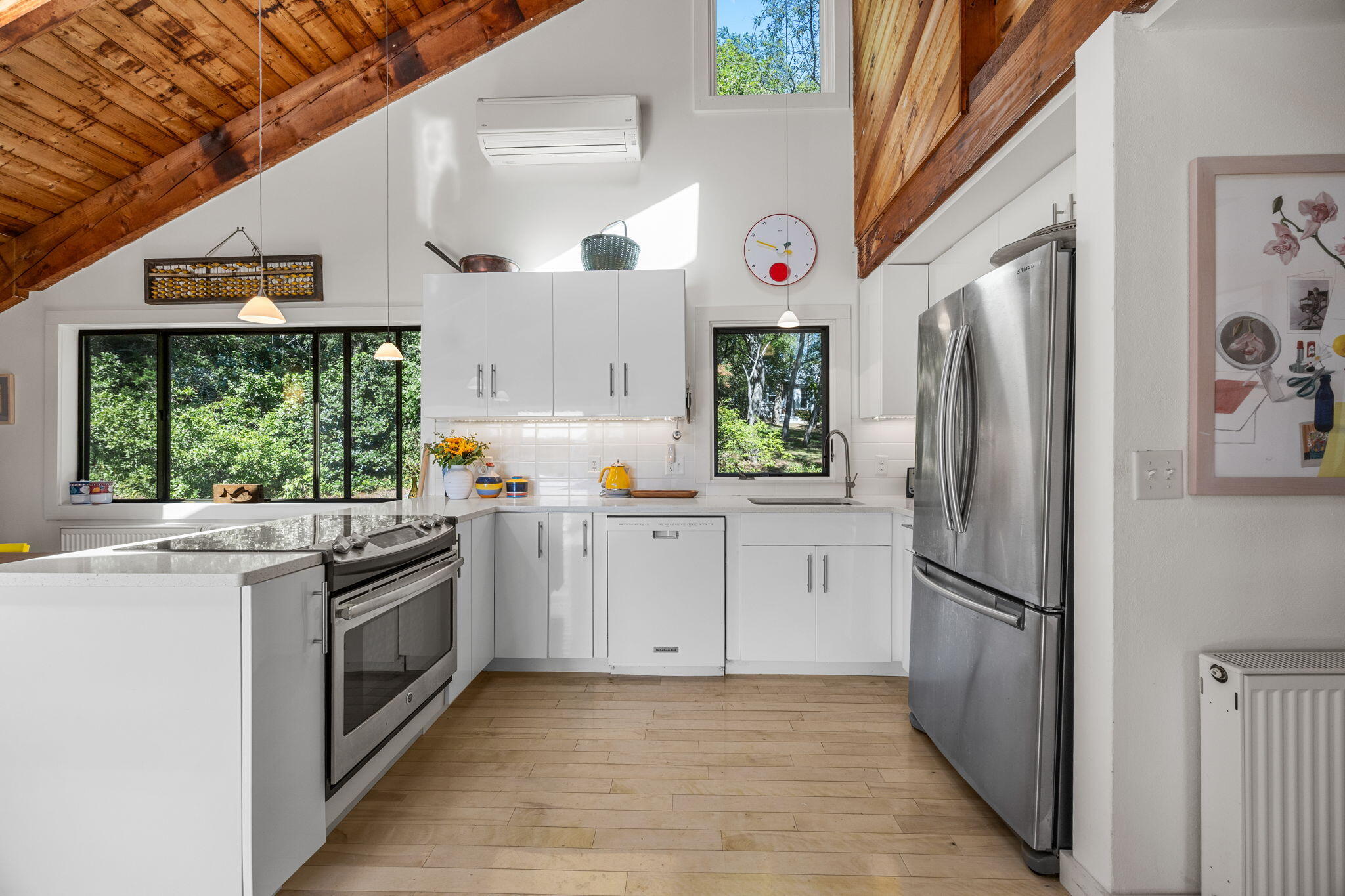 20 Lil's Way Wellfleet, MA 02631 - Photo 9 of 43 a kitchen with stainless steel appliances granite countertop a refrigerator a sink a stove and white cabinets with wooden floor