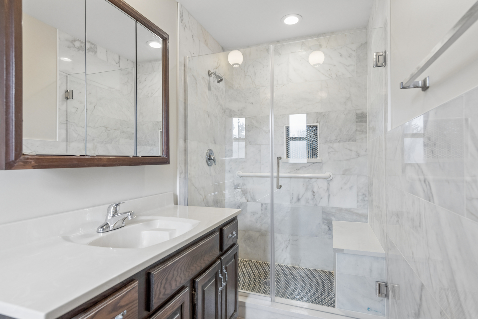 5017 Kenneth Drive Crystal Lake, IL 60014 - Photo 13 of 20 a bathroom with a sink and a mirror