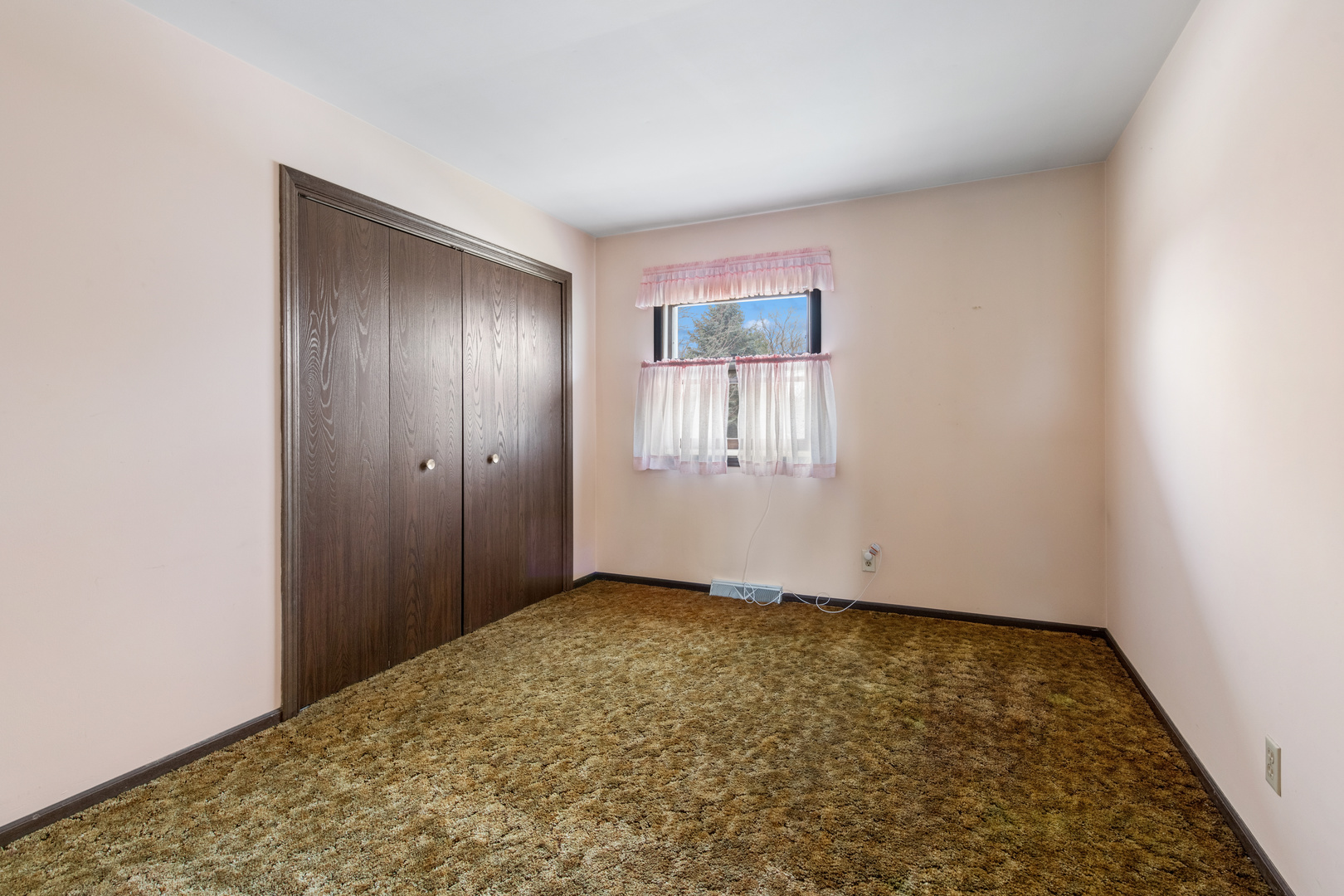 5017 Kenneth Drive Crystal Lake, IL 60014 - Photo 16 of 20 an empty room with wooden floor and windows