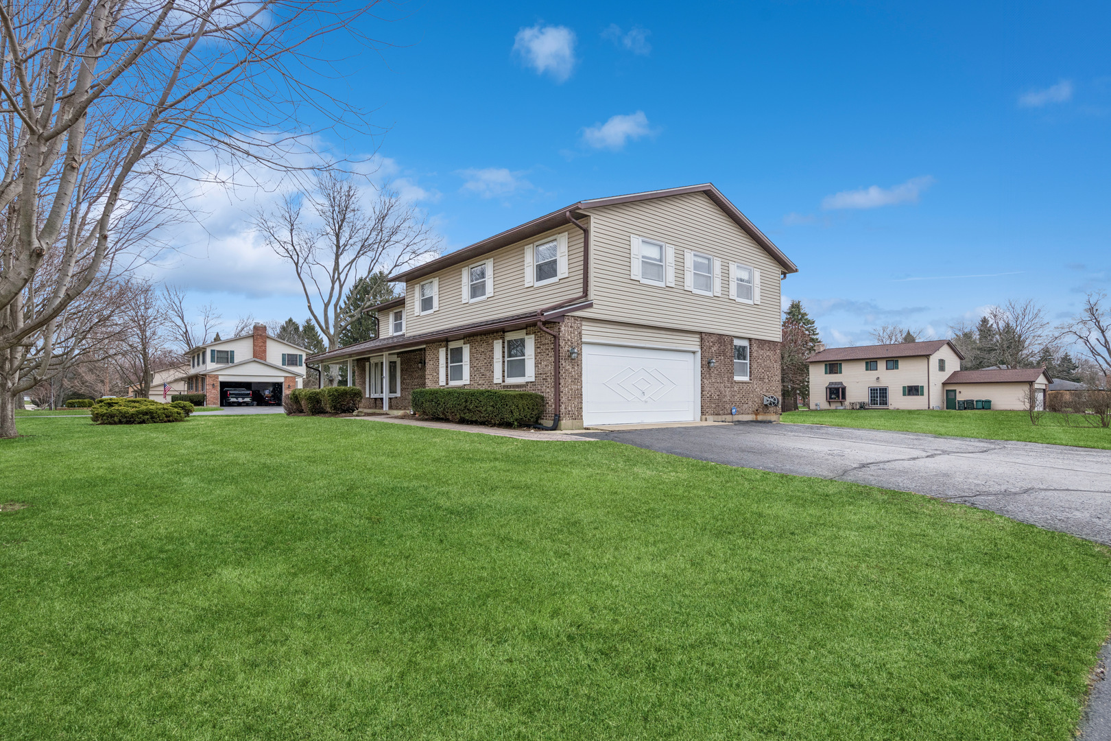 5017 Kenneth Drive Crystal Lake, IL 60014 - Photo 17 of 20 a view of a big house with a big yard and large trees