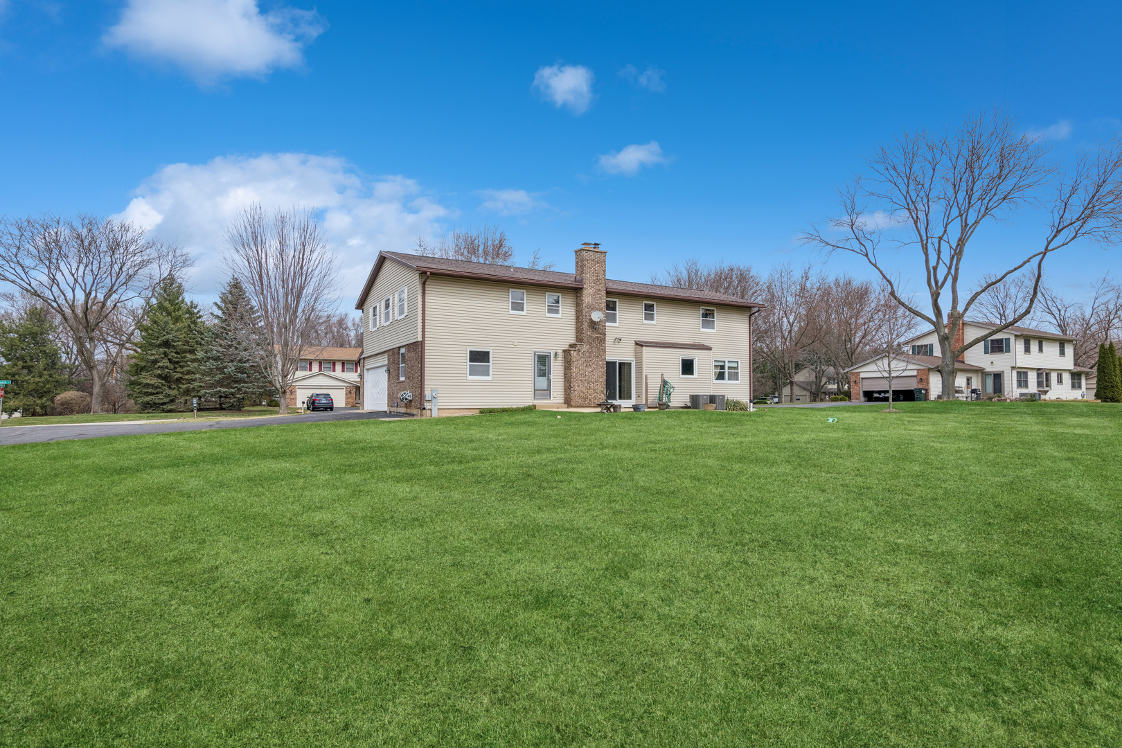 5017 Kenneth Drive Crystal Lake, IL 60014 - Photo 20 of 20 a view of a house with a big yard with large tree
