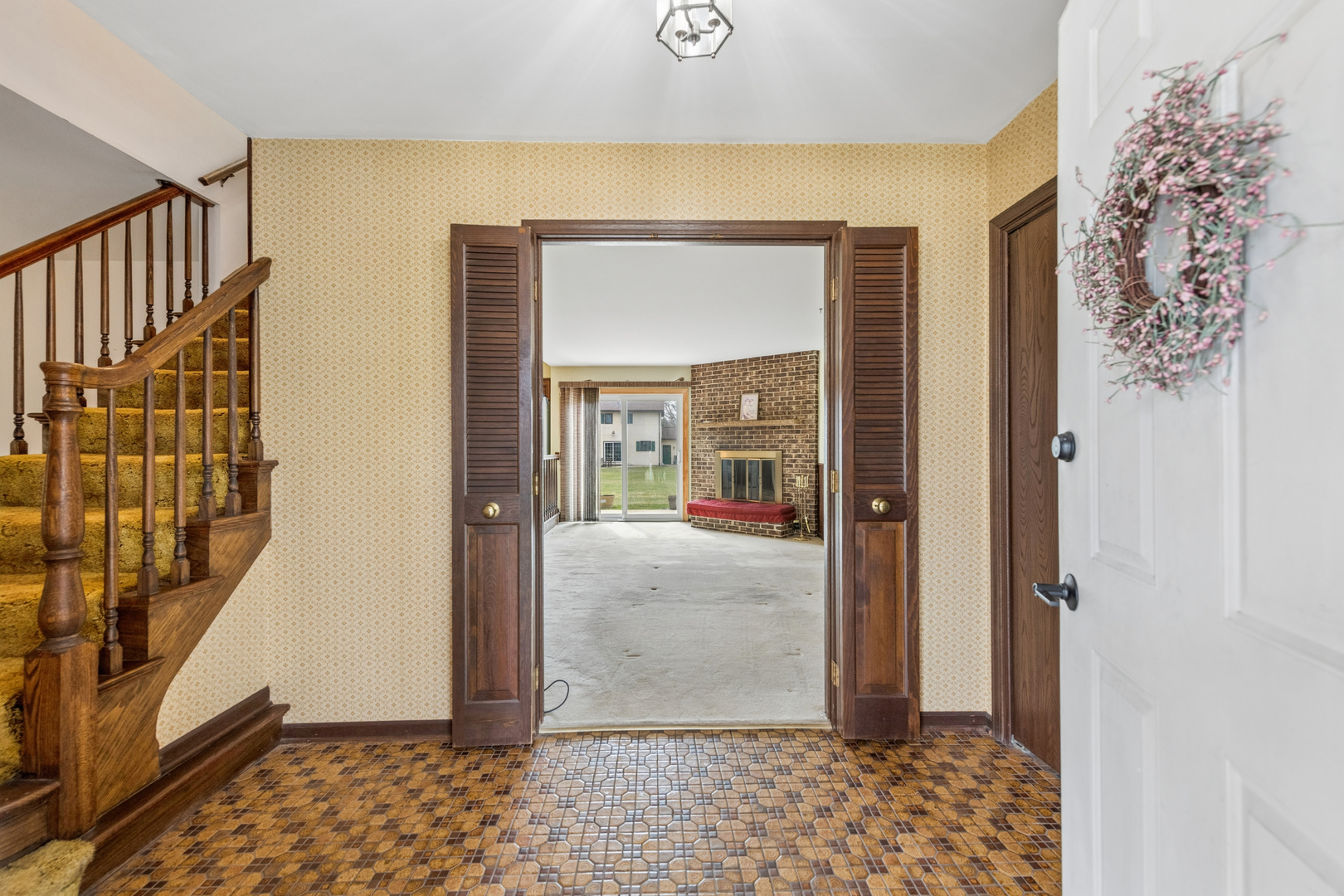5017 Kenneth Drive Crystal Lake, IL 60014 - Photo 3 of 20 a view of a hallway with wooden floor and a livingroom