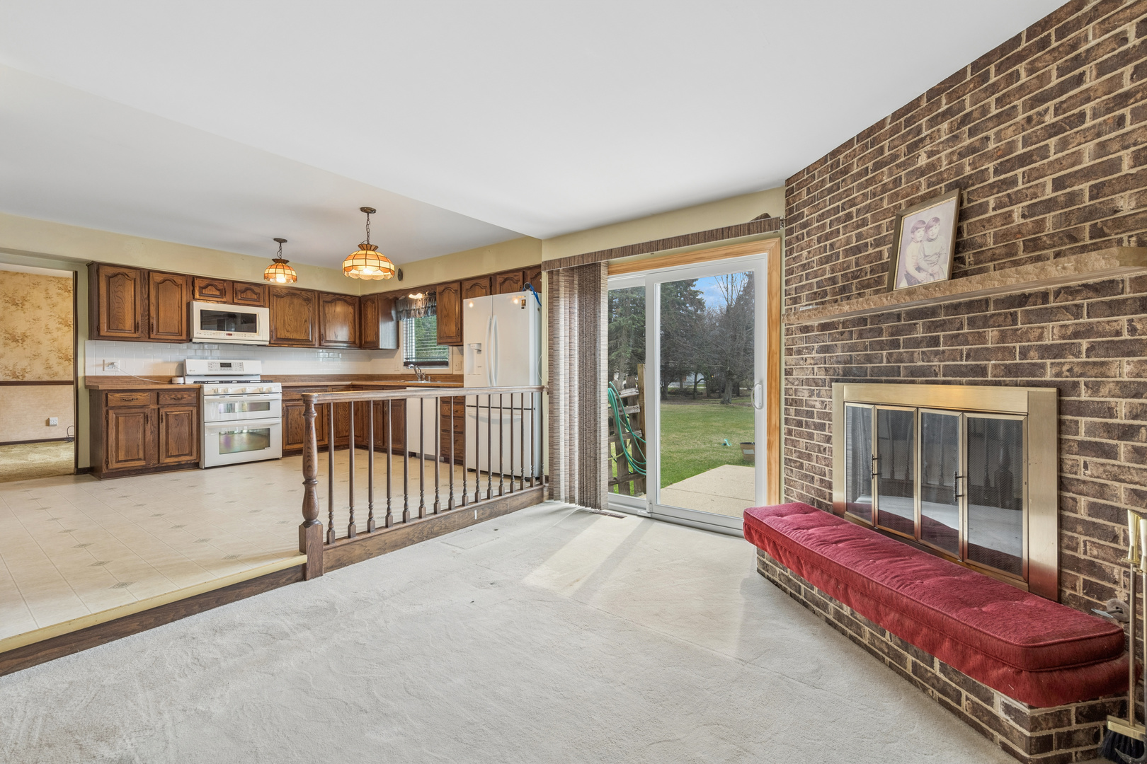 5017 Kenneth Drive Crystal Lake, IL 60014 - Photo 8 of 20 a living room with furniture and a fireplace