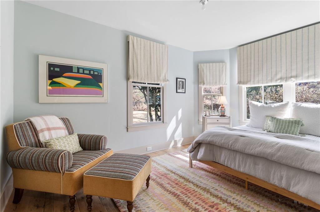 1021 Gilbert Street Southeast Atlanta, GA 30316 - Photo 16 of 24 a bedroom with a bed and wooden floor