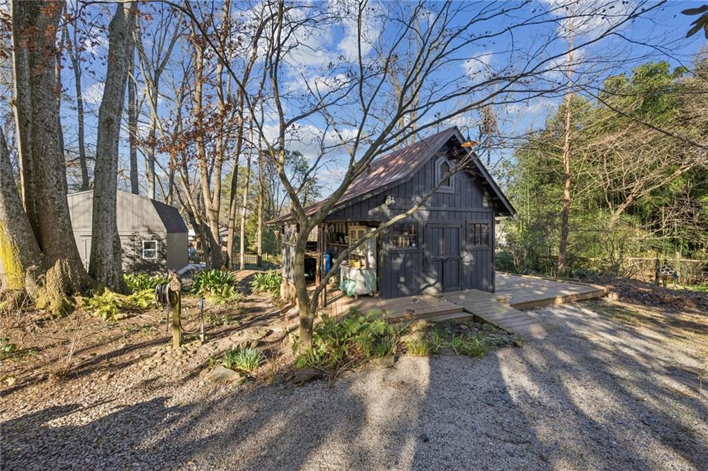 1021 Gilbert Street Southeast Atlanta, GA 30316 - Photo 21 of 24 a backyard of a house with large trees and outdoor seating