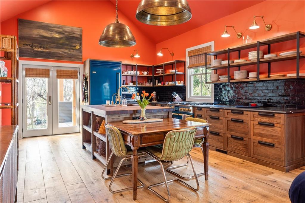 1021 Gilbert Street Southeast Atlanta, GA 30316 - Photo 7 of 24 a view of a patio with dining table and chairs with wooden floor