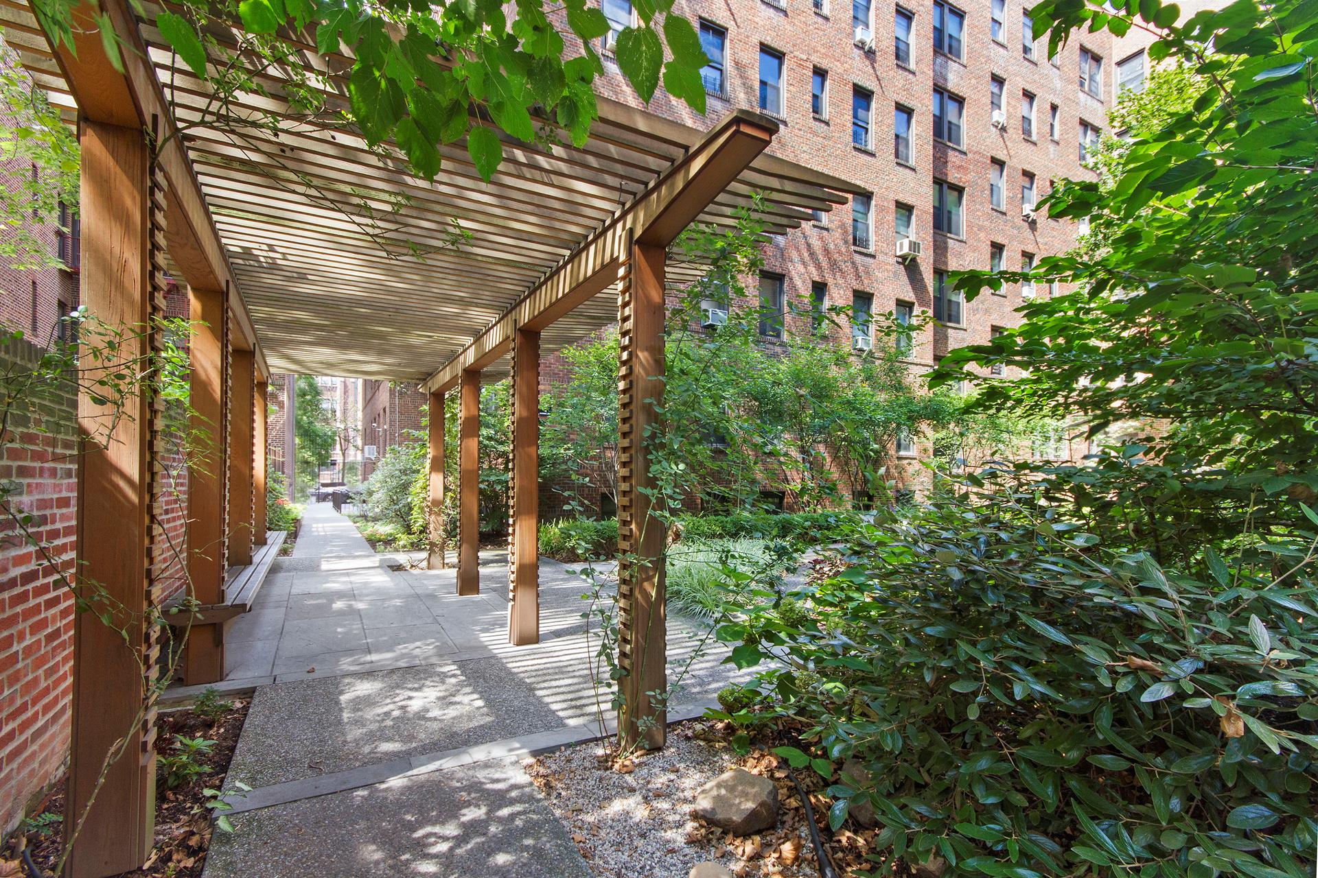 83-10 35th Avenue, Unit 2V Queens, NY 11372 - Photo 8 of 10 a view of a pathway of a building