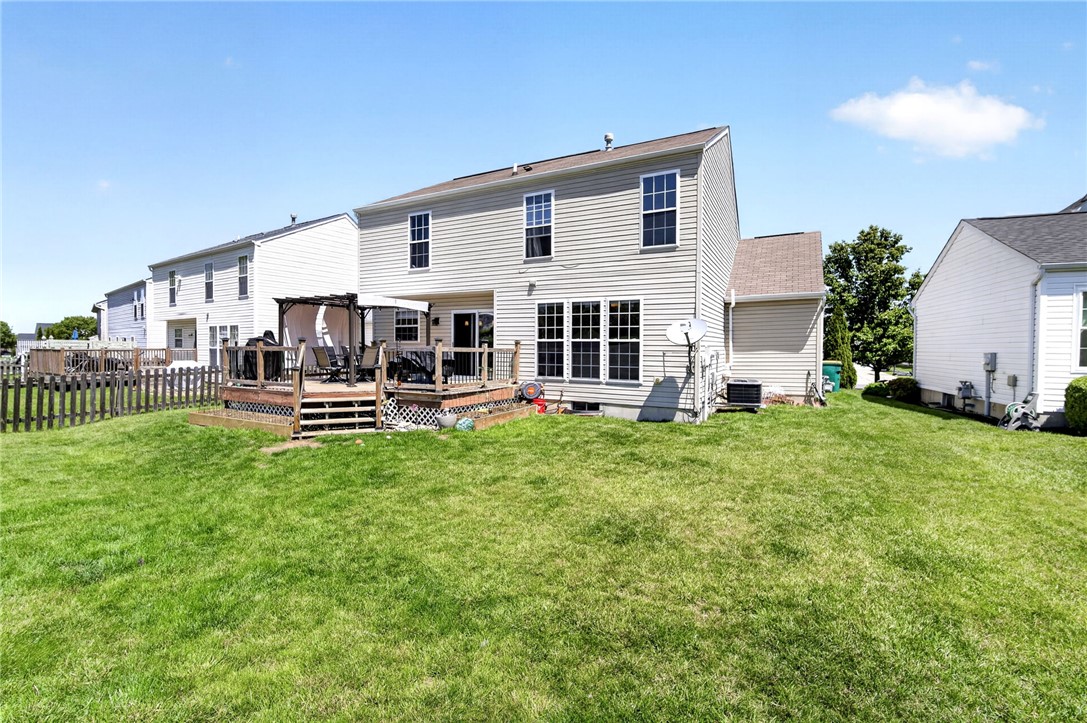 39 Holly Court Springboro, OH 45066 - Photo 33 of 42 This spacious backyard features a wooden deck, perfect for outdoor entertaining.