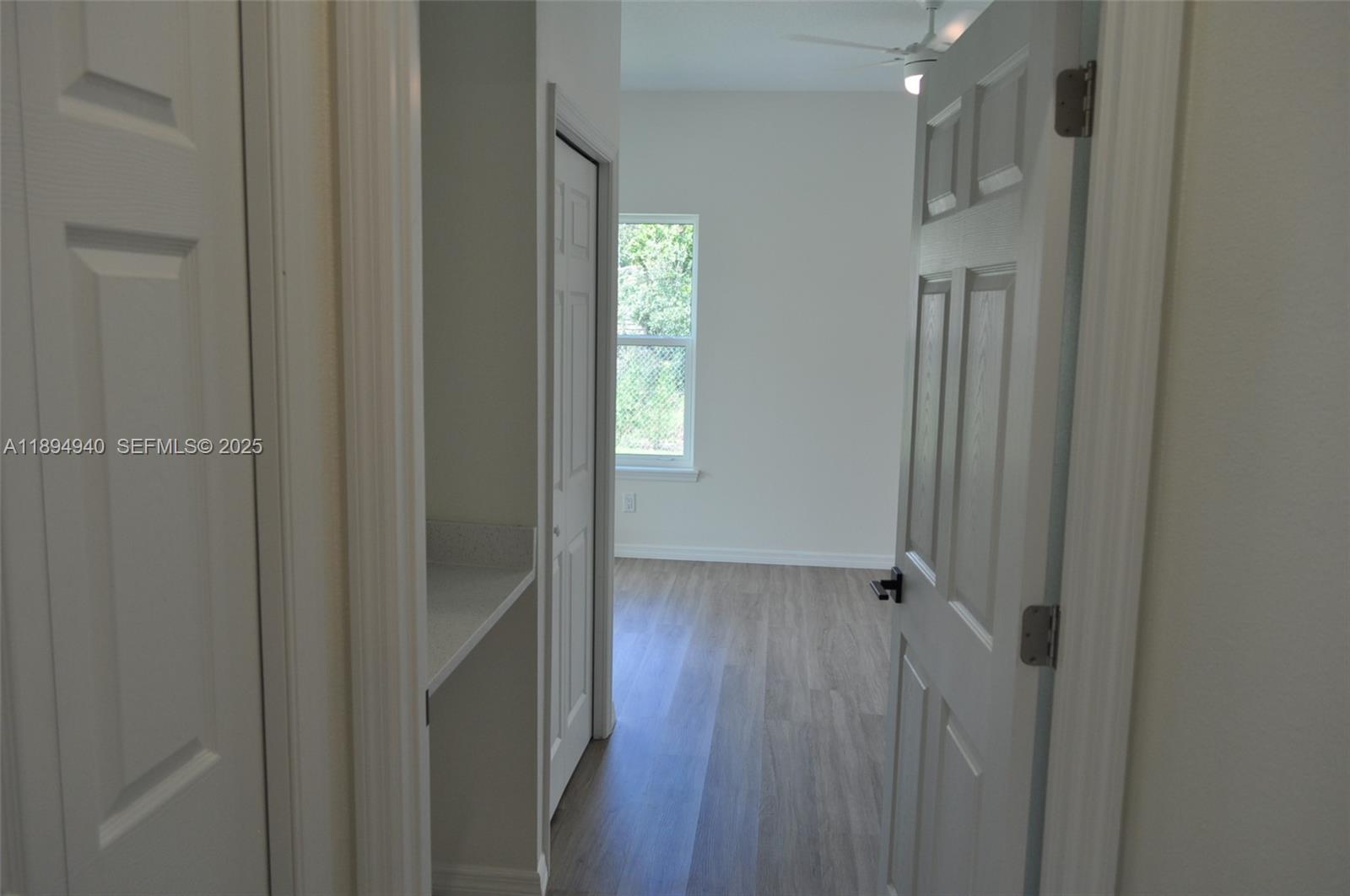 4125 Mandarin Road, Unit 4125 Sebring, FL 33875 - Photo 9 of 18 a view of hallway with wooden floor