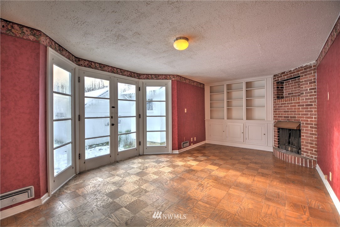 1603 South Machias Road Snohomish, WA 98290 - Photo 10 of 28 a view of an empty room with a fireplace and a window