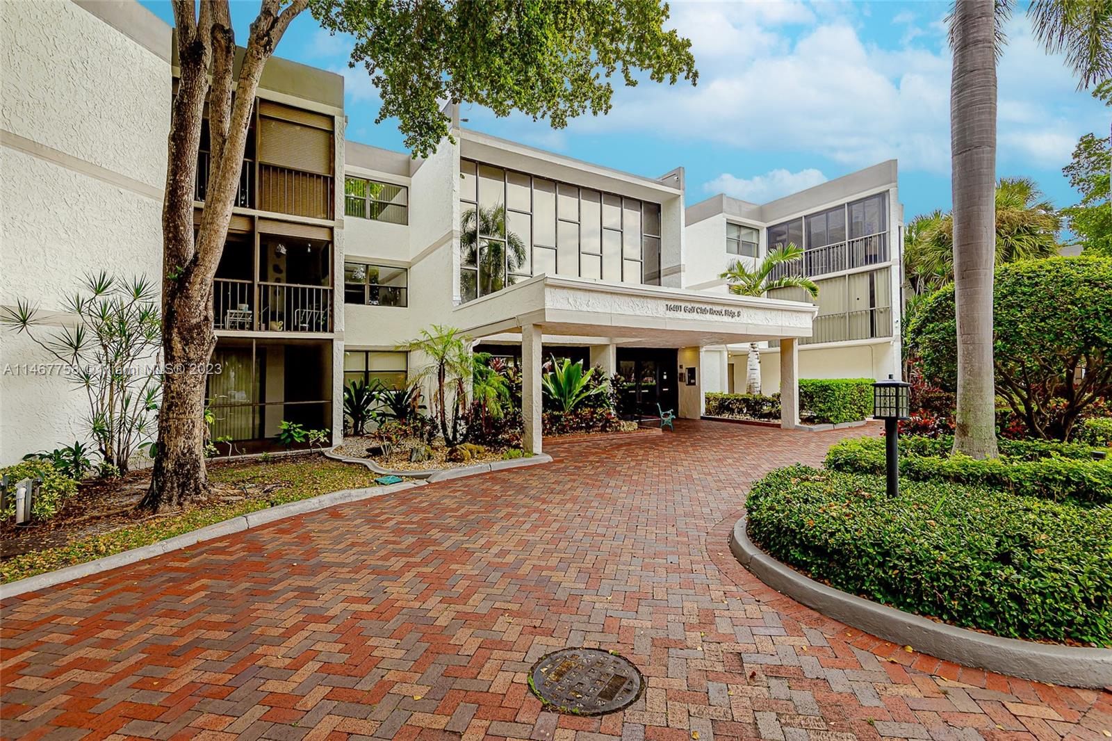 16401 Golf Club Road, Unit 311 Weston, FL 33326 - Photo 2 of 33 a view of a building with a garden