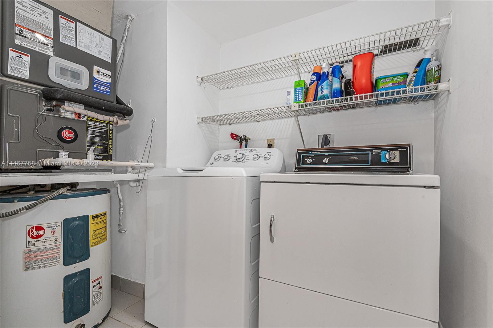 16401 Golf Club Road, Unit 311 Weston, FL 33326 - Photo 28 of 33 a utility room with dryer and washer
