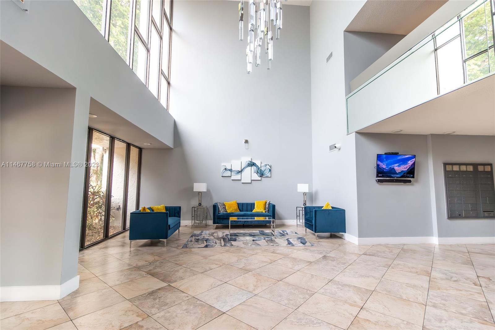 16401 Golf Club Road, Unit 311 Weston, FL 33326 - Photo 4 of 33 a living room with furniture