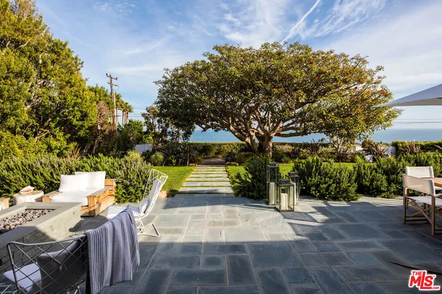 a view of backyard with green space