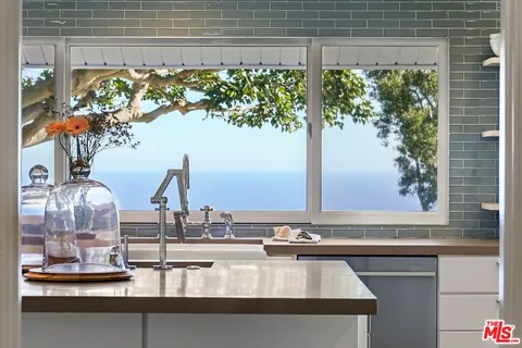a view of a sink with a dining table
