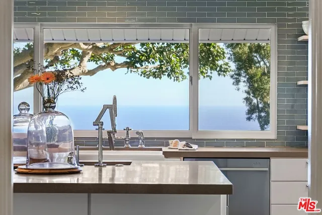 a view of a sink with a dining table