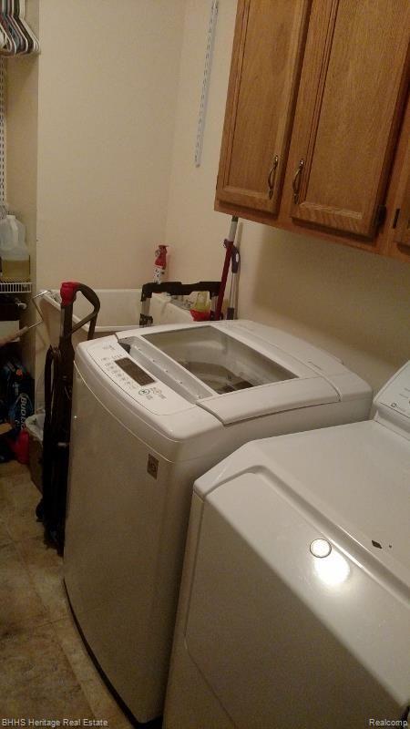 5647 South Bull Run Road Gregory, MI 48137 - Photo 30 of 30 Laundry room with utility sink and new washer and dryer