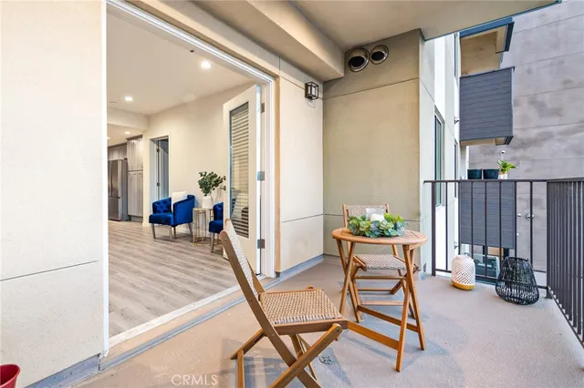 a view of a chairs and table in patio