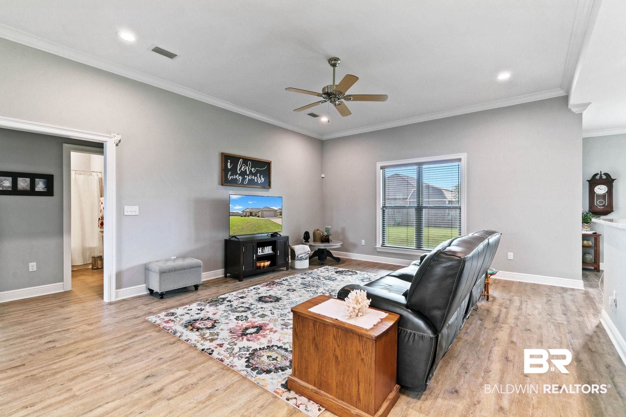 9388 Pembrook Loop Fairhope, AL 36532 - Photo 11 of 53 Living area featuring light wood-style flooring, a ceiling fan, ornamental molding, and recessed lighting