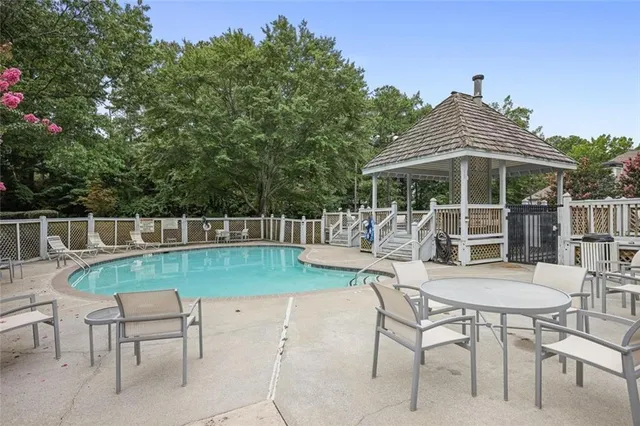 a view of a chair and table in the patio