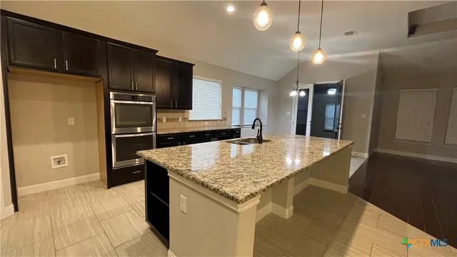 a bathroom with a toilet and a microwave