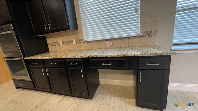 a bathroom with a sink and a large mirror