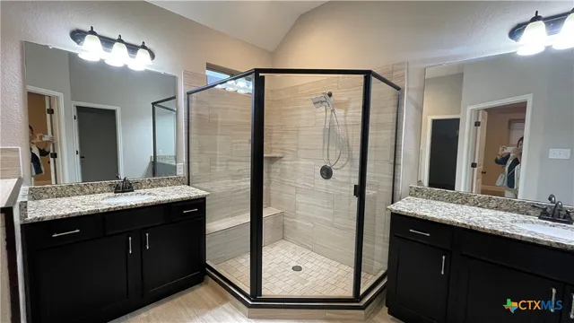 a view of an empty room and window and wooden floor