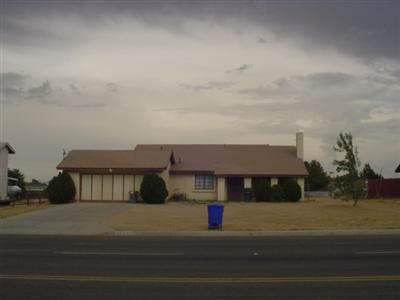 12693 Amethyst Road Victorville, CA 92392 - Photo 1 of 1 a front view of a house with a yard