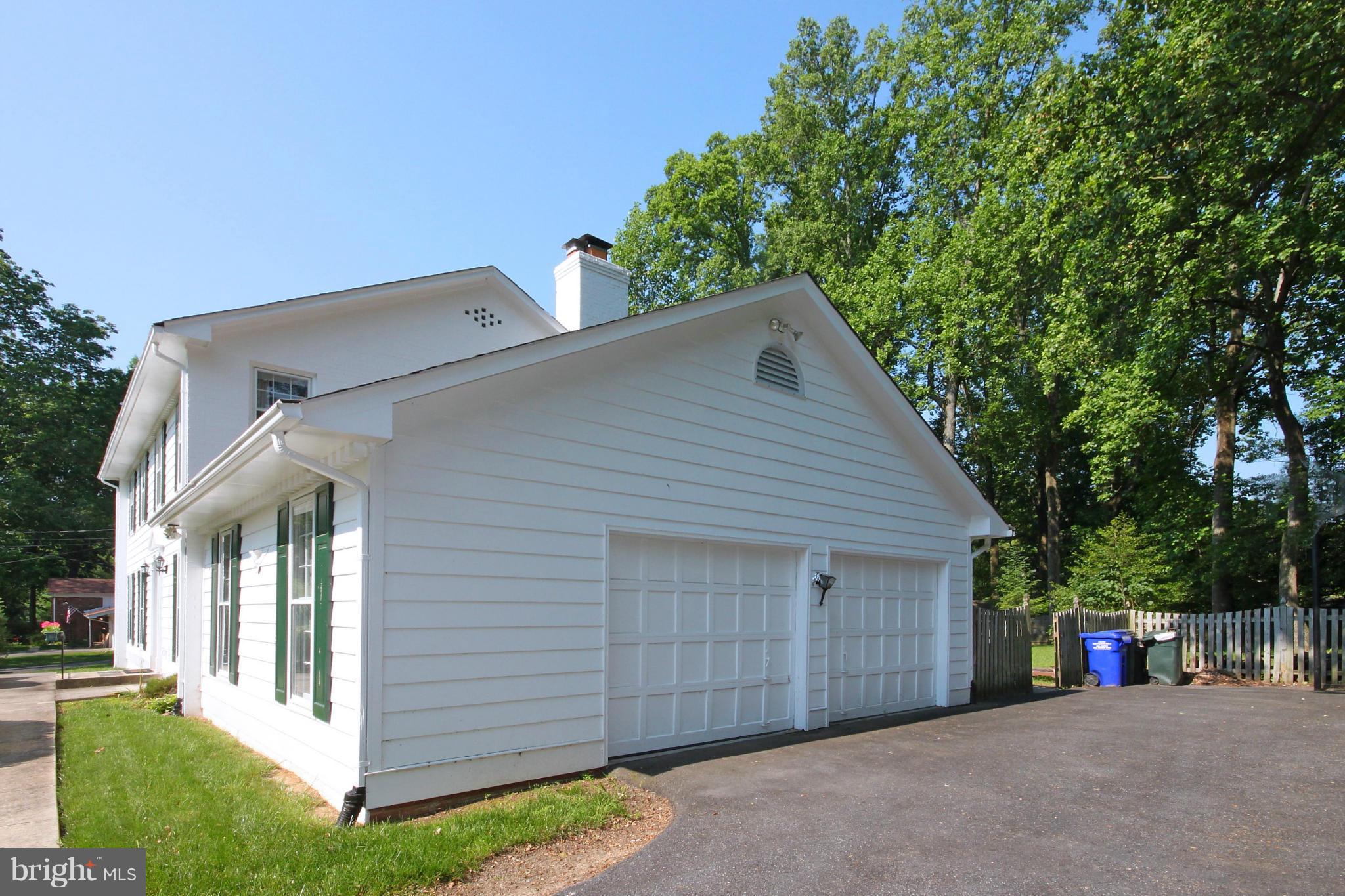 9106 Seven Locks Road Bethesda, MD 20817 - Photo 22 of 23 front view of a house with a street