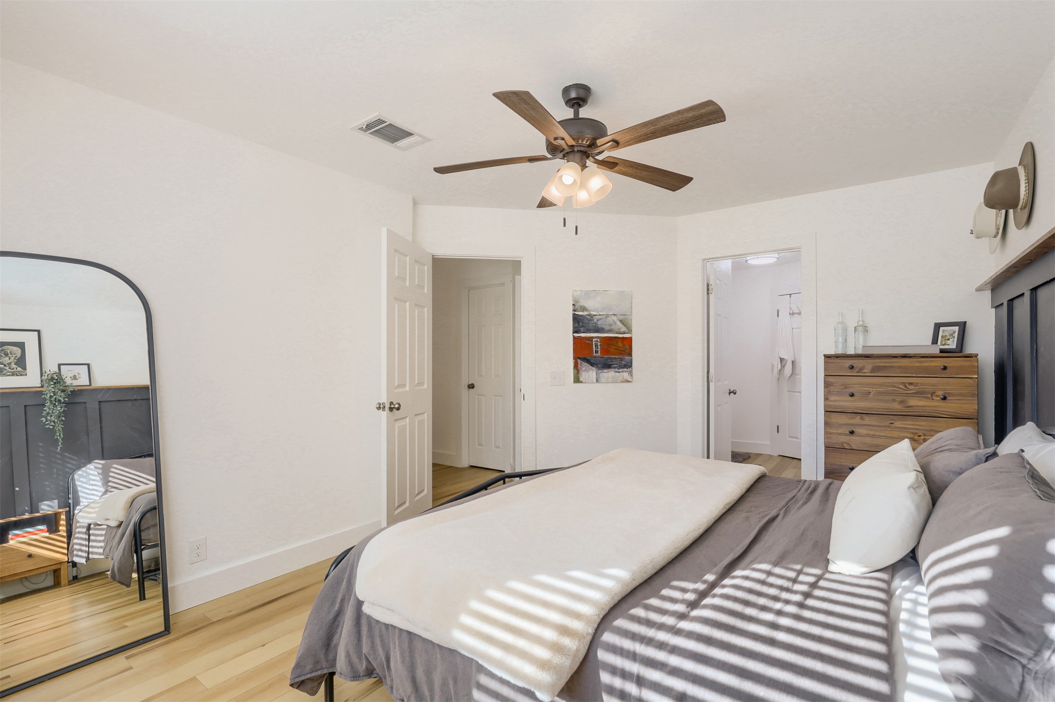 104 Aspen Trail Georgetown, TX 78626 - Photo 12 of 29 a bedroom with a bed and a chandelier