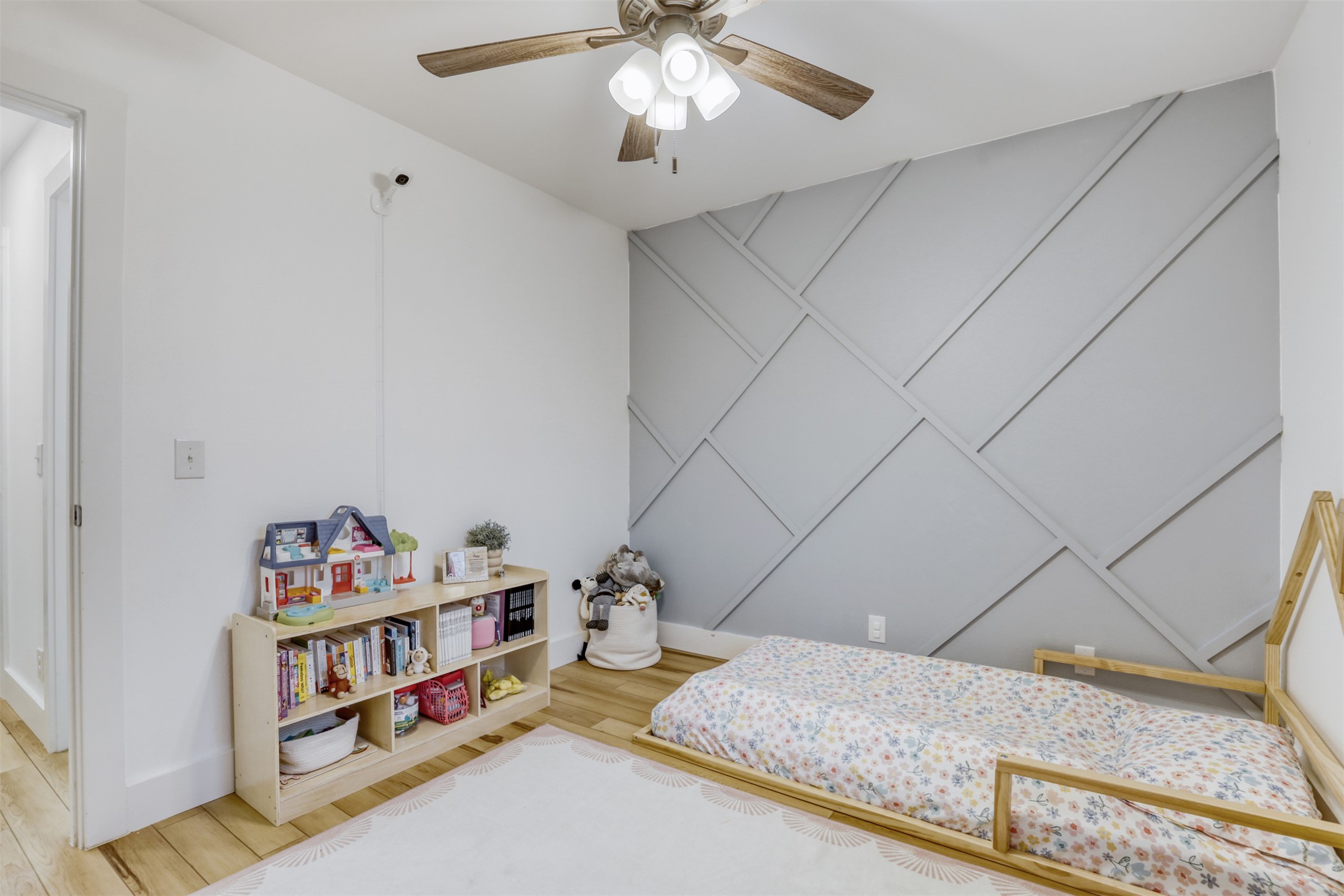 104 Aspen Trail Georgetown, TX 78626 - Photo 17 of 29 a bedroom with furniture and a chandelier