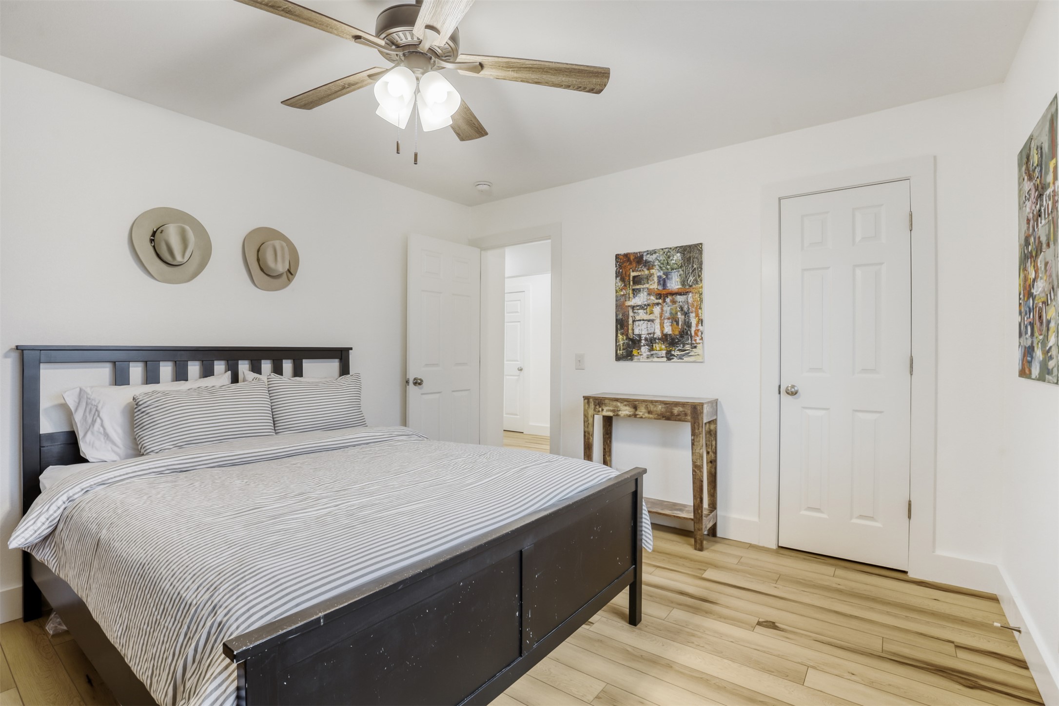 104 Aspen Trail Georgetown, TX 78626 - Photo 22 of 29 a bedroom with a bed and a chandelier