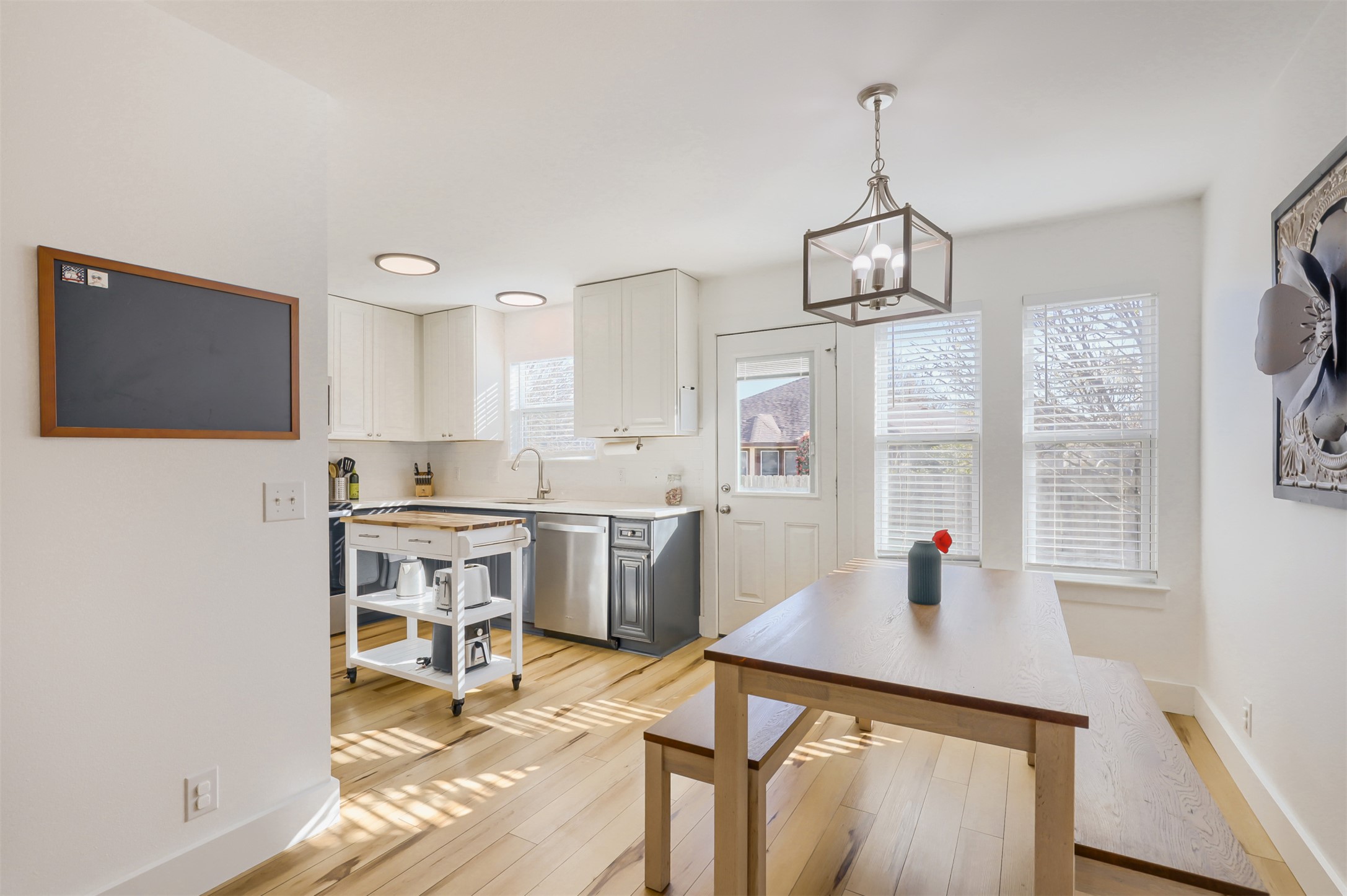 104 Aspen Trail Georgetown, TX 78626 - Photo 6 of 29 a kitchen with stainless steel appliances a dining table chairs and granite counter tops