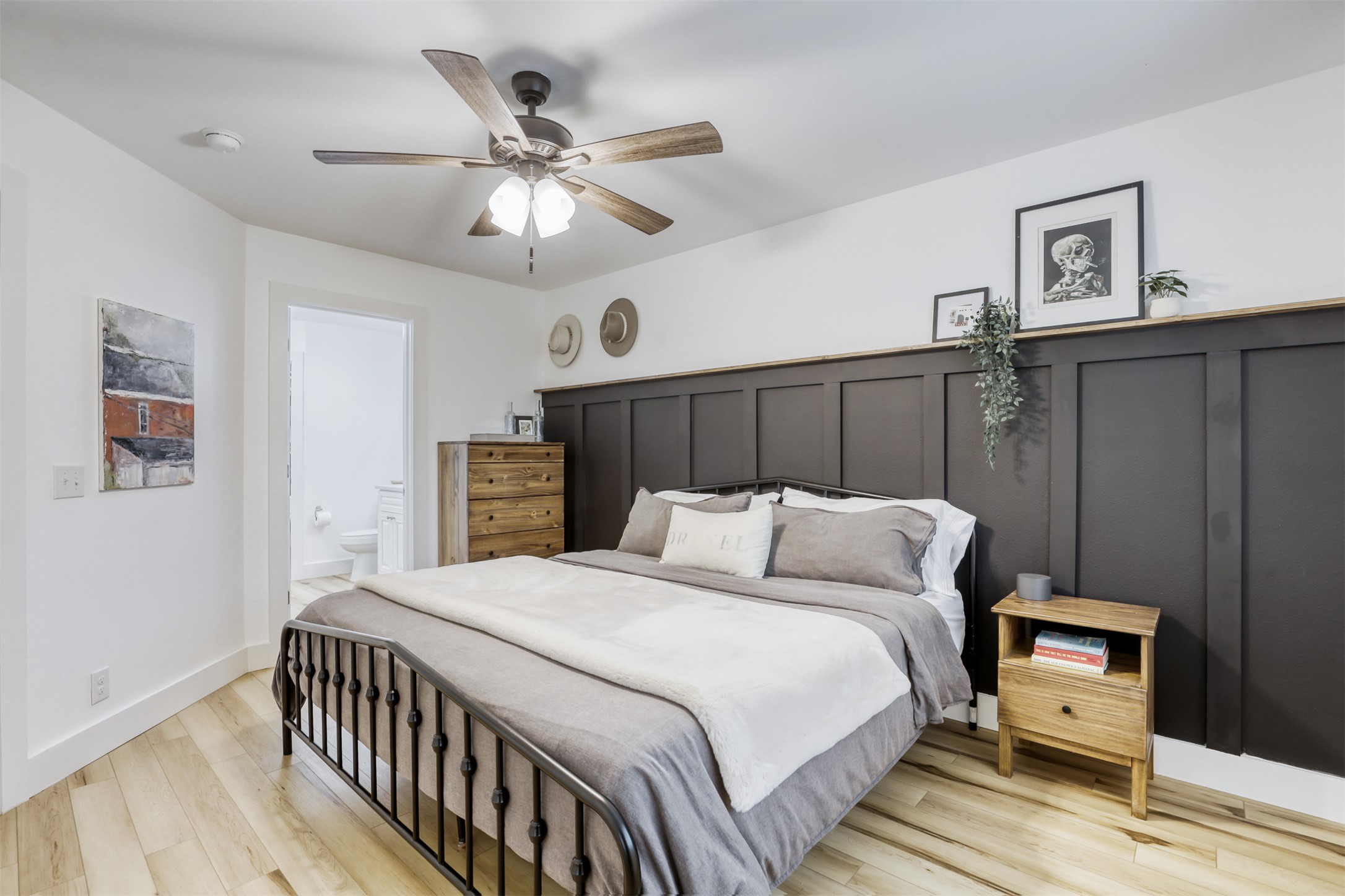 104 Aspen Trail Georgetown, TX 78626 - Photo 10 of 29 a bedroom with a bed and a chandelier