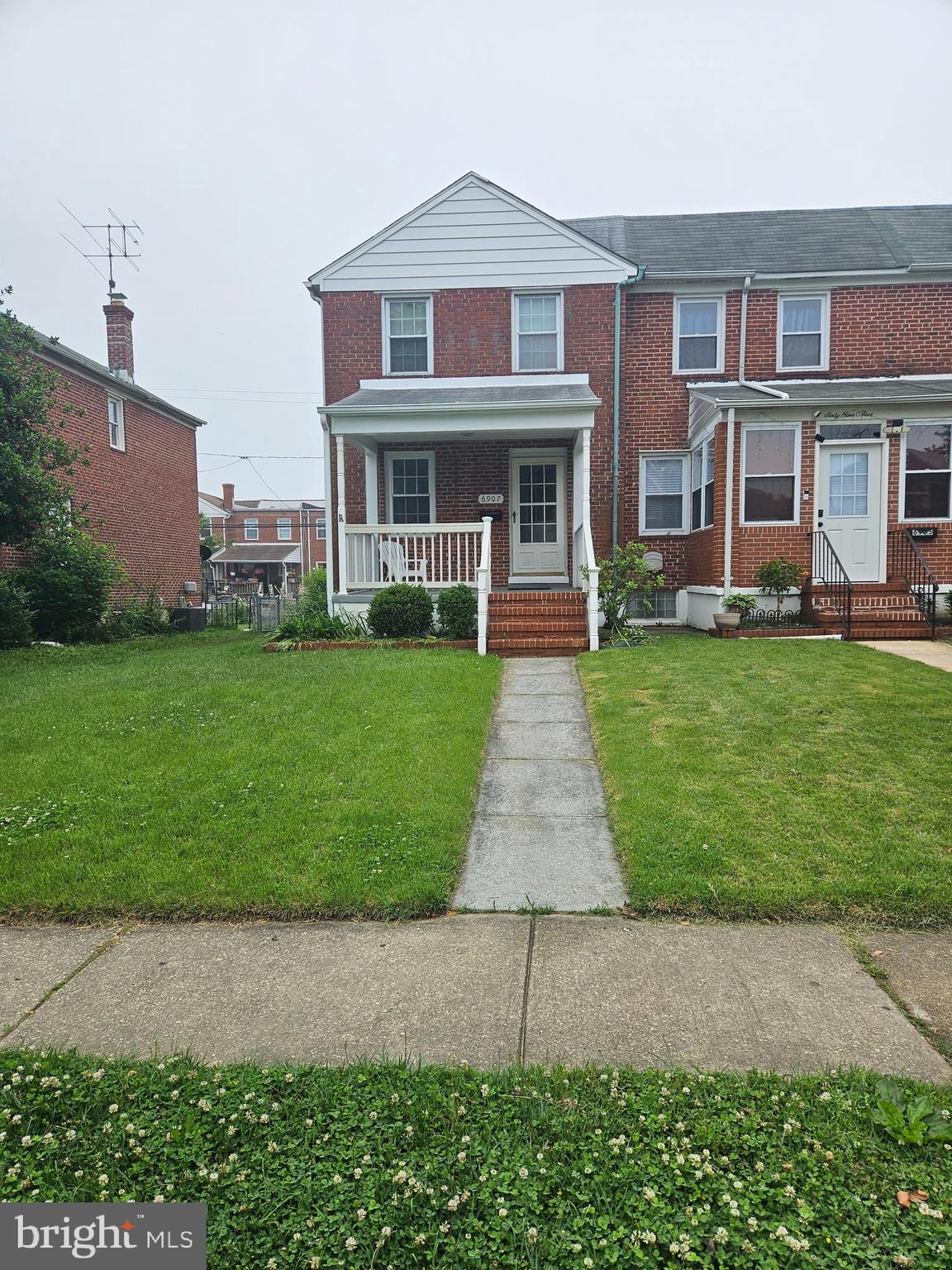 6907 Belclare Road Baltimore, MD 21222 - Photo 1 of 26 a front view of a house with garden