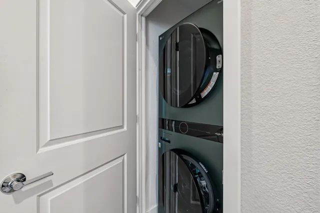 a bedroom with bed and painting on the wall