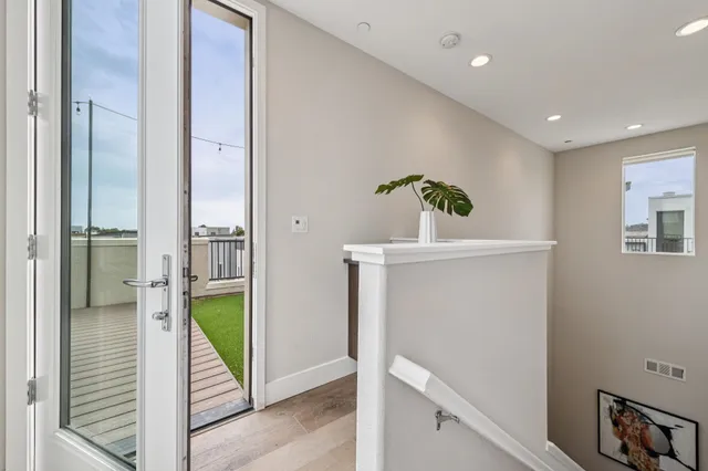 a view of hallway with bathroom