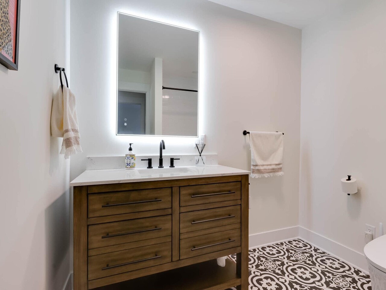 707 West Woodland Road Lake Bluff, IL 60044 - Photo 12 of 14 a bathroom with a sink and a mirror