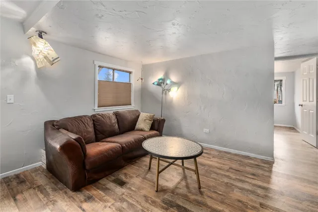 a living room with furniture and a table