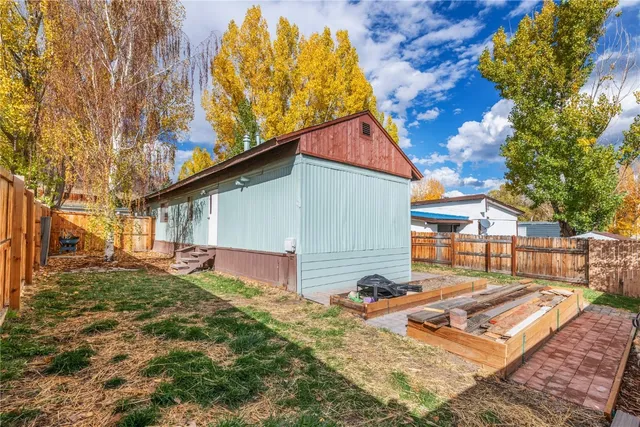 a backyard of a house with lots of green space