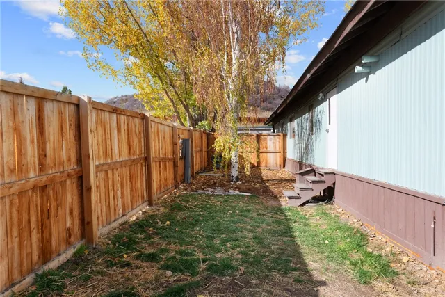 a backyard of a house with outdoor seating