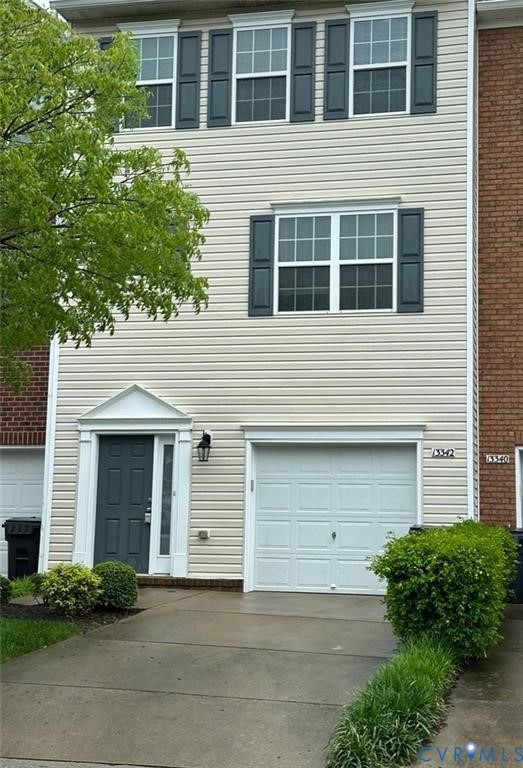 13342 Diamond Ridge Drive Midlothian, VA 23112 - Photo 1 of 19 a front view of a house with garage