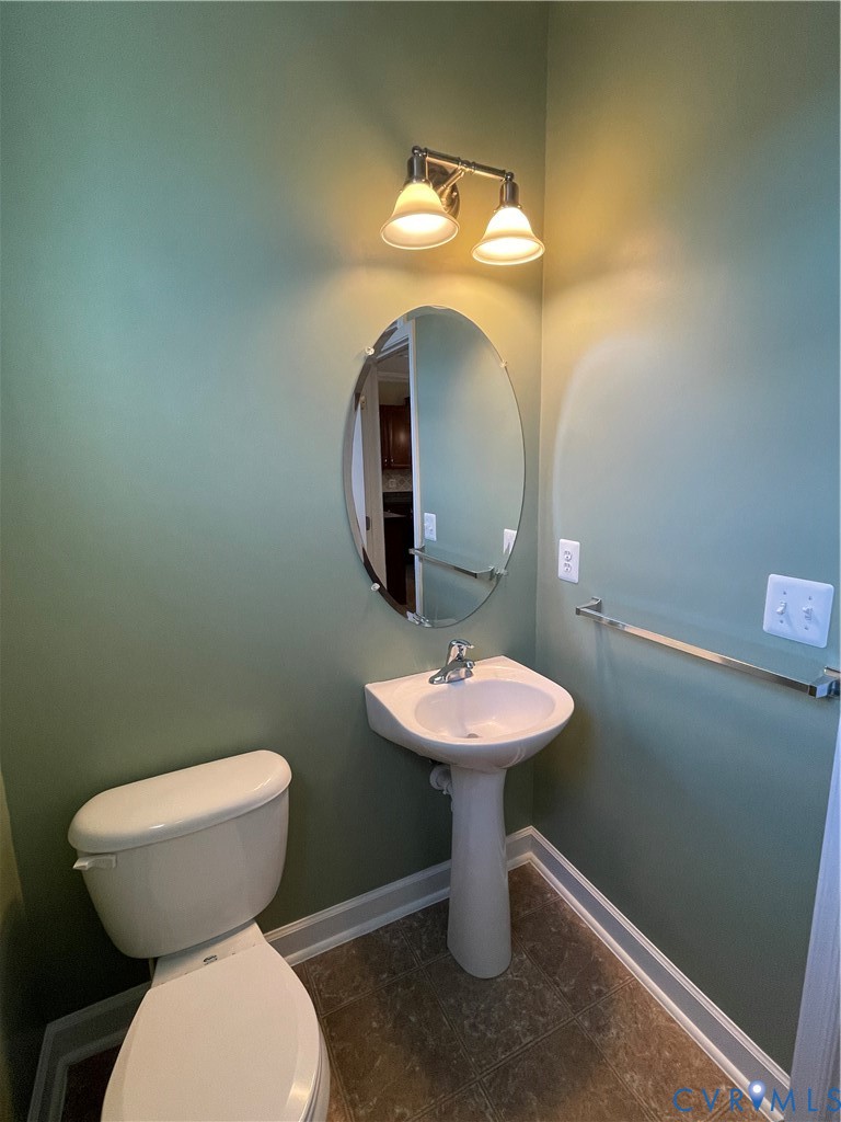 13342 Diamond Ridge Drive Midlothian, VA 23112 - Photo 11 of 19 a bathroom with a toilet sink and mirror